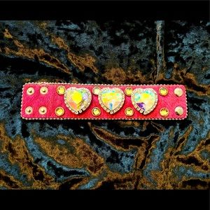 Pink calf hair leather bracelet with crystal hearts.